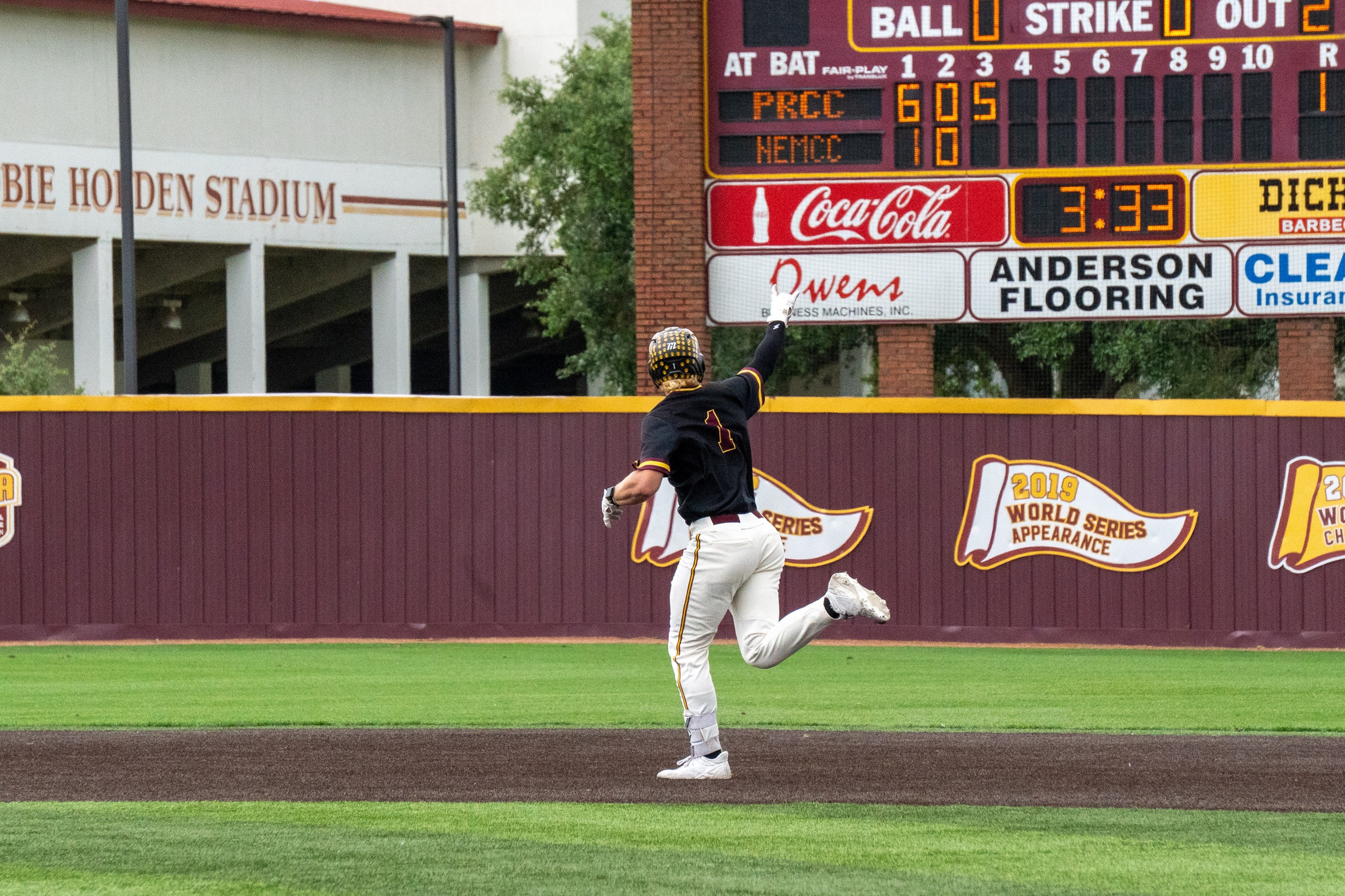 Topher Jones (Hernando) celebrates as he rounds the bases after hitting a two-run homer (Karisa Watkins/PRCC Athletics)