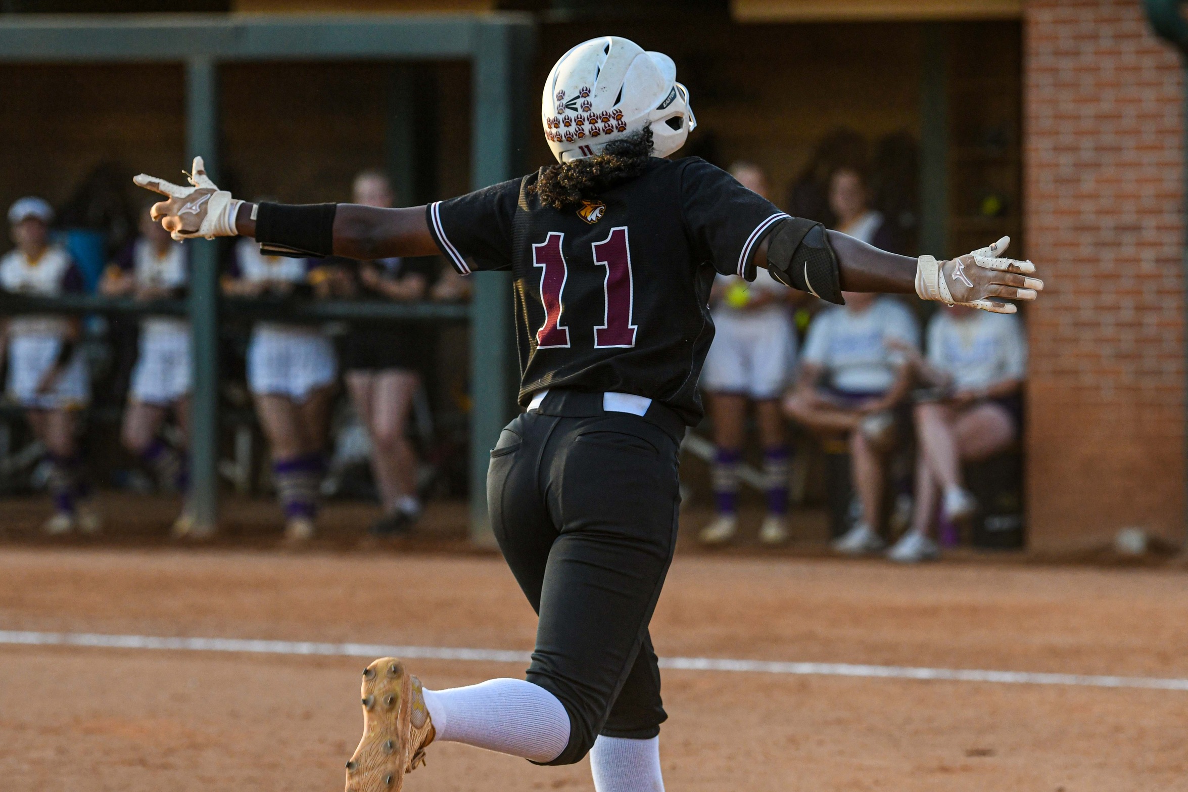 Kai Goodman (New Orleans; John Curtis) celebrates as she heads for the plate after a home run. (Richard Gleber)