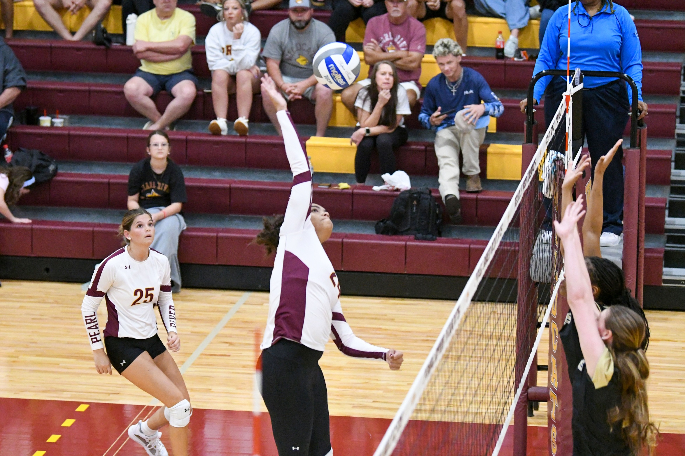 Reagan Ziegler (Lacombe, La.; Lakeshore) extends for a kill attempt against East Central (Richard Gleber)
